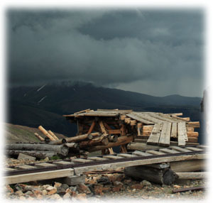 storm rolling in over abandoned mine rails